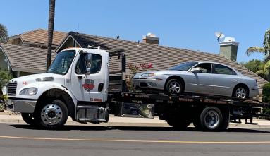 Tow truck hauling away a car